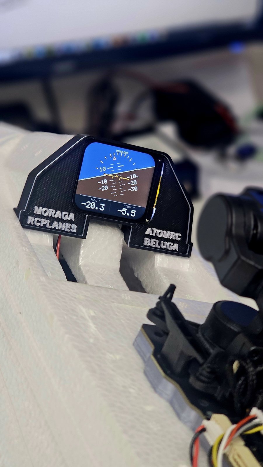 Attitude indicator showing a left bank in the ATOMRC Beluga